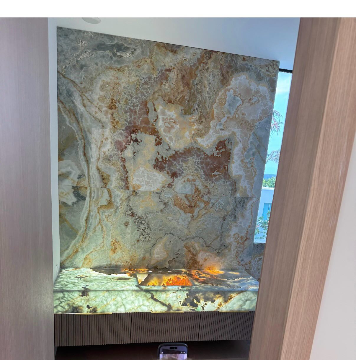 Backlit onyx accent wall